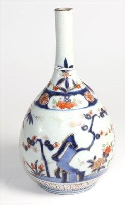 Lot 482 - Imari porcelain bottle vase 18th century, painted with bamboo, prunus and papaya, 32cm high