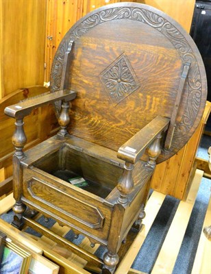 Lot 1093 - A 1930's carved oak monk's chair (lacking seat)