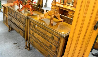 Lot 1095 - A 1930's oak chest of drawers, a matching dressing table, an Art Nouveau style single door wardrobe