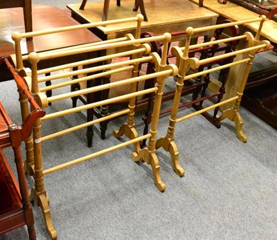 Lot 1119 - Three pine towel rails and a modern stained mahogany towel rail