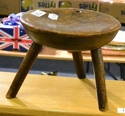 Lot 1125 - Burr elm stool on three splayed legs