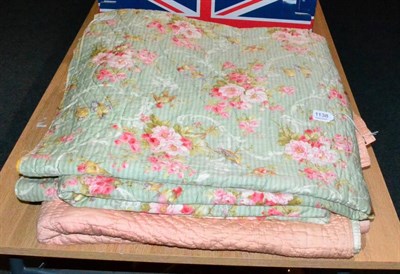 Lot 1138 - Circa 1930's pale green reversible bed cover printed with birds and roses, 230cm by 210cm: and...