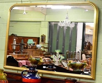Lot 1216 - An arched gilt over mantel mirror