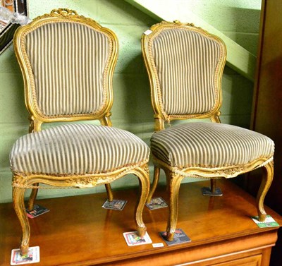 Lot 1227 - A pair of small French upholstered side chairs