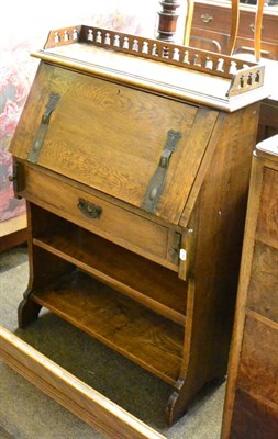 Lot 1236 - An early 20th century oak bureau with Art Nouveau handle and mounts