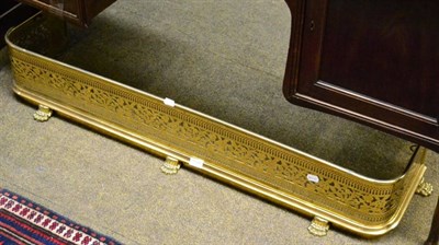 Lot 1246 - A pierced brass fire curb