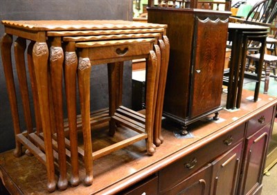Lot 1248 - A 20th century nest of four tables, another nest of three tables and an oak bedside cabinet