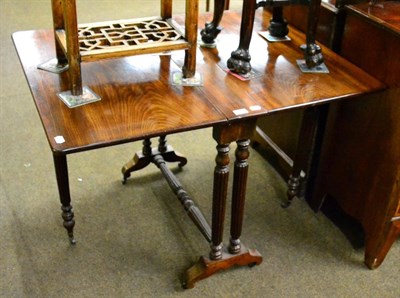 Lot 1258 - A 19th century mahogany Sutherland table on fluted supports