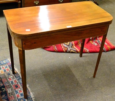Lot 1272 - A 19th century string inlaid D shaped fold over tea table