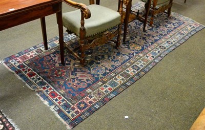 Lot 1273 - Kuba rug, North East Caucasus, the indigo field of geometric motifs enclosed by Harshang...