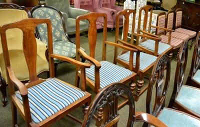 Lot 1288 - A set of four oak open armchairs with drop in seats together with three upholstered side chairs...