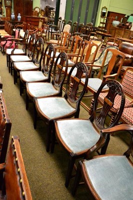 Lot 1289 - A set of eight Edwardian mahogany and satinwood dining chairs upholstered in close nailed...