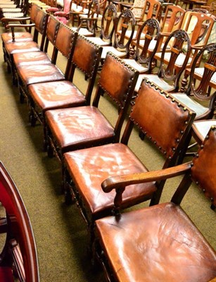 Lot 1290 - A set of eight leather close nailed chairs including two carvers