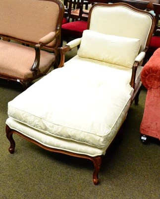 Lot 1293 - A modern French style upholstered armchair and matching footstool