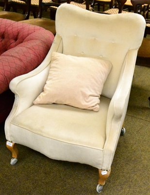 Lot 1297 - An upholstered armchair