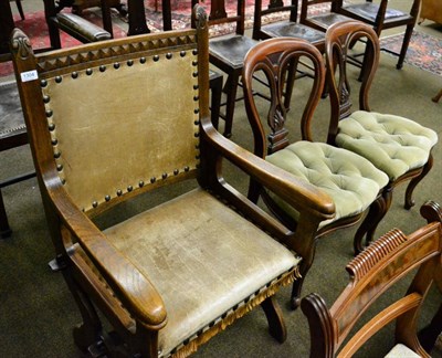 Lot 1304 - An oak and leather armchair on X shape support and a pair of Victorian mahogany dining chairs...
