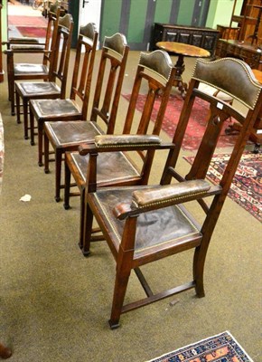 Lot 1306 - A set of six dining chairs, two carvers and four side chairs, with shaped top rails over a...