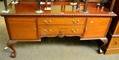 Lot 1320 - A mahogany sideboard on cabriole supports with ball and claw feet