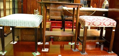 Lot 1321 - An upholstered mahogany stool, another stool and an oval occasional table