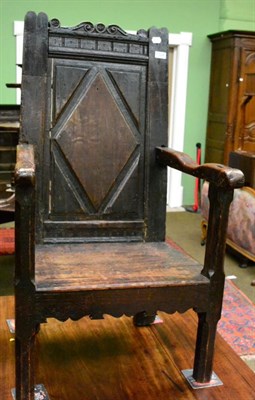 Lot 1324 - A joined oak armchair