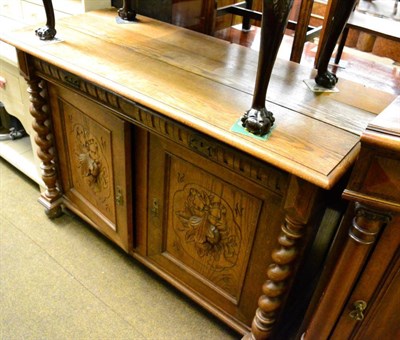 Lot 1328 - A carved oak sideboard