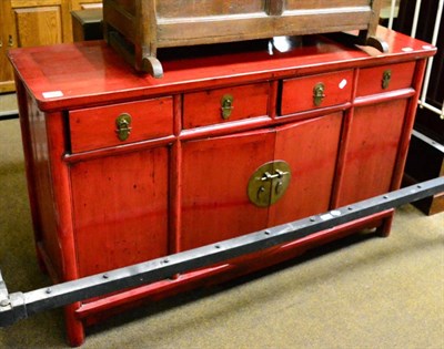 Lot 1332 - A modern Chinese red lacquered sideboard