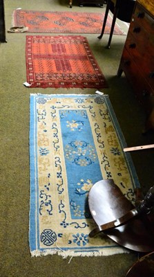 Lot 1339 - Afghan rug, the madder field with three elephant foot guls enclosed by borders of hooked guls,...