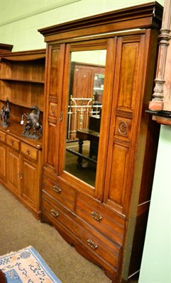 Lot 1342 - An early 20th century wardrobe with single mirrored door and drawers below