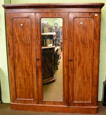 Lot 1347 - A Victorian mahogany three panel wardrobe