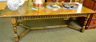 Lot 1354 - A good reproduction oak refectory table with fluted frieze and baluster legs