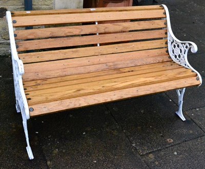 Lot 1372 - Victorian painted cast iron garden bench with oak slatted seat