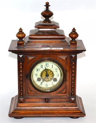 Lot 13 - A Victorian walnut cased striking mantel clock, movement backplate stamped Junghans