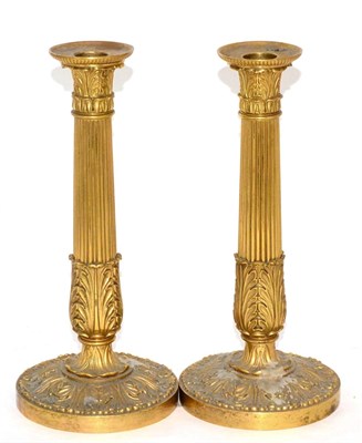 Lot 28 - A pair of French Empire style gilt bronze candlesticks