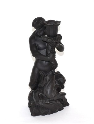 Lot 29 - A Wedgwood black basalt candlestick figure modelled as Triton