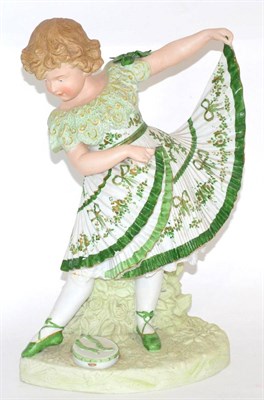 Lot 31 - A German bisque figure of a child in green dress