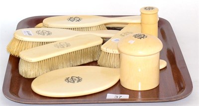 Lot 37 - A late Victorian ivory-handled dressing table set, each piece decorated with a monogram, comprising