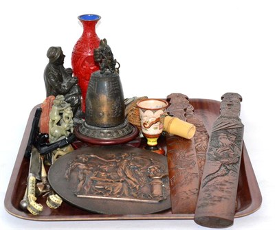 Lot 50 - Soapstone carvings, page turners, circular plaque, oriental bell, decorative mask etc