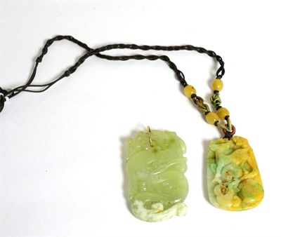 Lot 66 - A jade pendant and a bowenite pendant