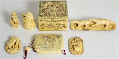 Lot 67 - A group of Japanese carvings comprising; a bone inro; a bone box and cover; two ivory netsukes,...