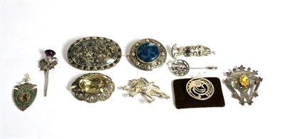 Lot 82 - A Scottish Iona silver citrine set Luckenbooth brooch, another Scottish citrine set brooch and...