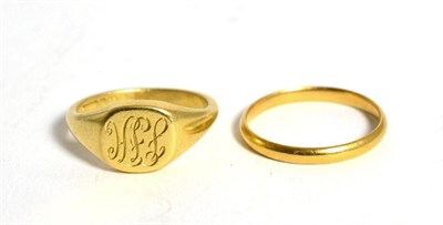 Lot 86 - An 18 carat gold signet ring and a 22 carat gold wedding band, both stamped (2)