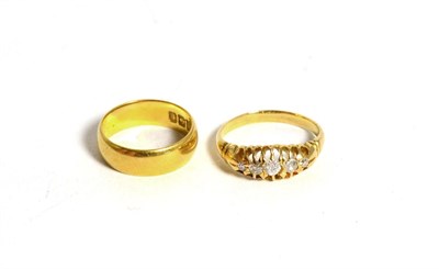 Lot 89 - A 22 carat gold band ring and a diamond ring (2)