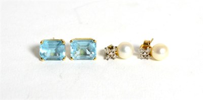 Lot 94 - A pair of cultured pearl and diamond earrings and a pair of blue topaz earrings (2)