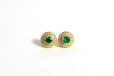 Lot 100 - A pair of emerald and diamond cluster earrings