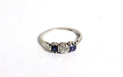 Lot 101 - A sapphire and diamond three stone ring, estimated diamond weight 0.25 carat approximately,...