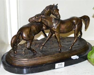 Lot 115 - A bronze group of two horses, marble base