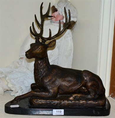 Lot 119 - A bronze model of a recumbent stag, marble base