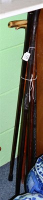 Lot 123 - An oak carved walking stick possibly Irish; an African ebony walking stick; a Brazilian Saints wood