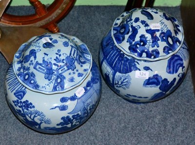 Lot 124 - A pair of Chinese blue and white jars and covers, 20th century, marks to base, floral design