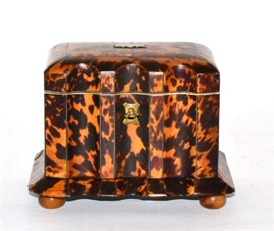 Lot 135 - A regency tortoiseshell tea caddy, of fluted rectangular form, the hinged top concealing two lidded